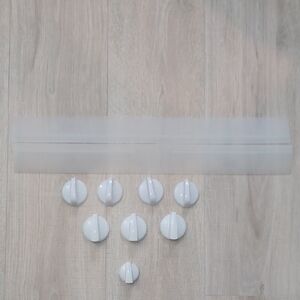 Bundle of cooktop range knobs, and two stove counter gap spill guards.